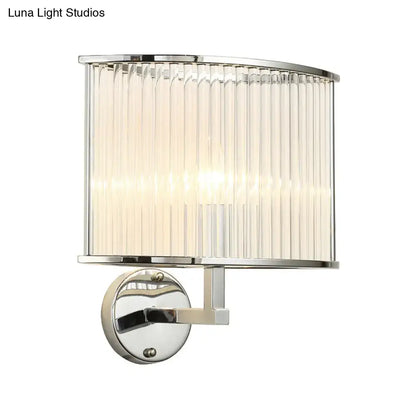 Modern silver finish wall lamp featuring a chrome base and clear crystal curved ribbed glass shade for living room