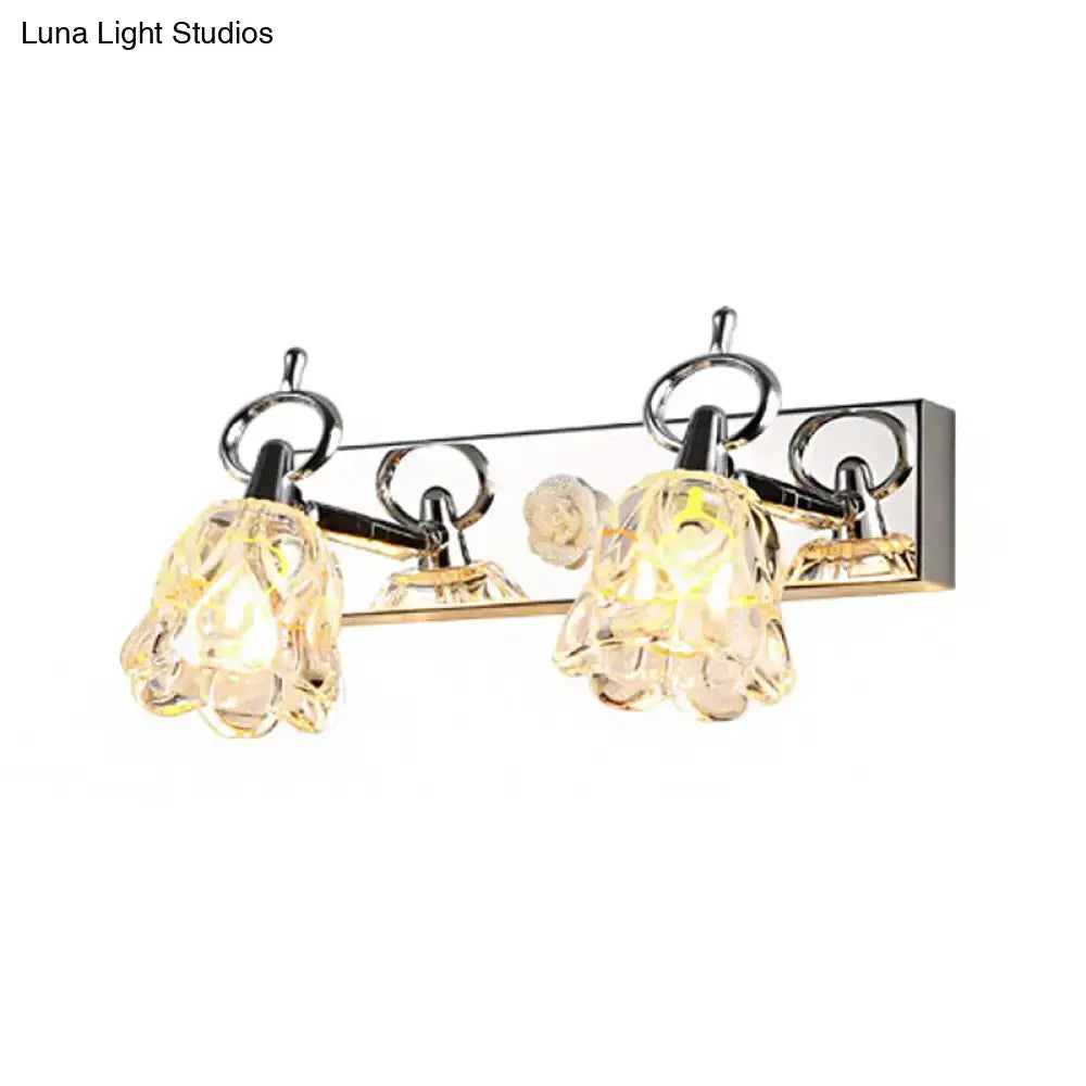 Modern silver finish wall light with clear glass flower-shaped shades for bathroom vanity illumination
