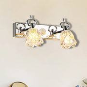 Modern wall light with silver finish and two clear glass flower-shaped shades for bathroom fixture