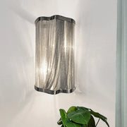 Modern silver finish wall mounted light with a sleek silver chain link tassel design for living room decor