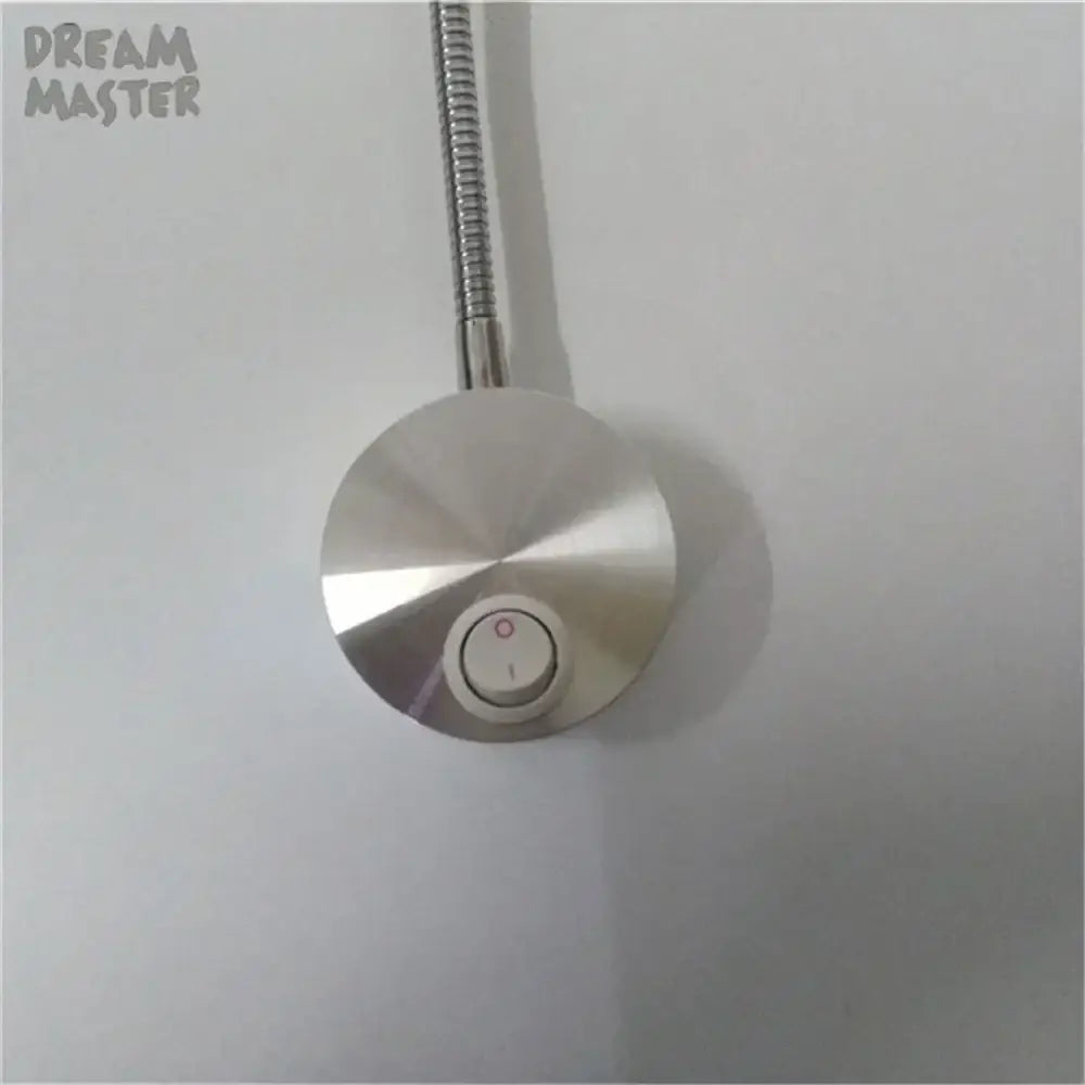 A sleek silver led wall lamp with a flexible metallic arm and adjustable knob for bedroom reading use