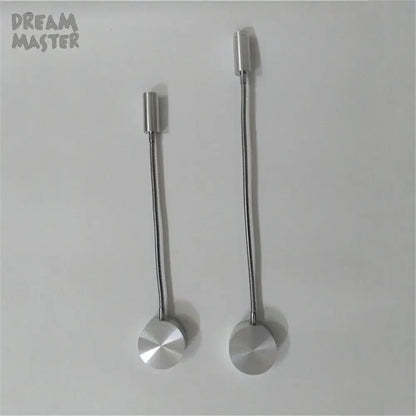 Two silver flexible led wall lamps with cylindrical heads and circular bases designed for bedroom reading use