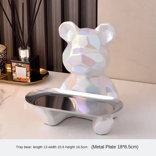 A sleek iridescent silver geometric bear storage box with metallic finish and facets for modern living room decorbites decor