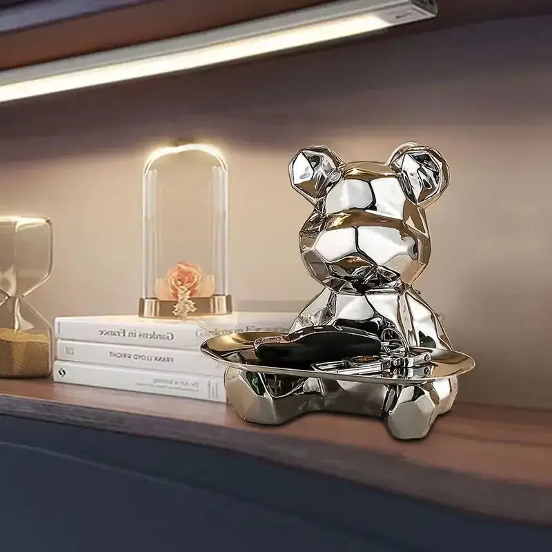 Modern silver geometric bear storage box with shiny metallic finish seated on a matching tray for living room decorbites geometric bear