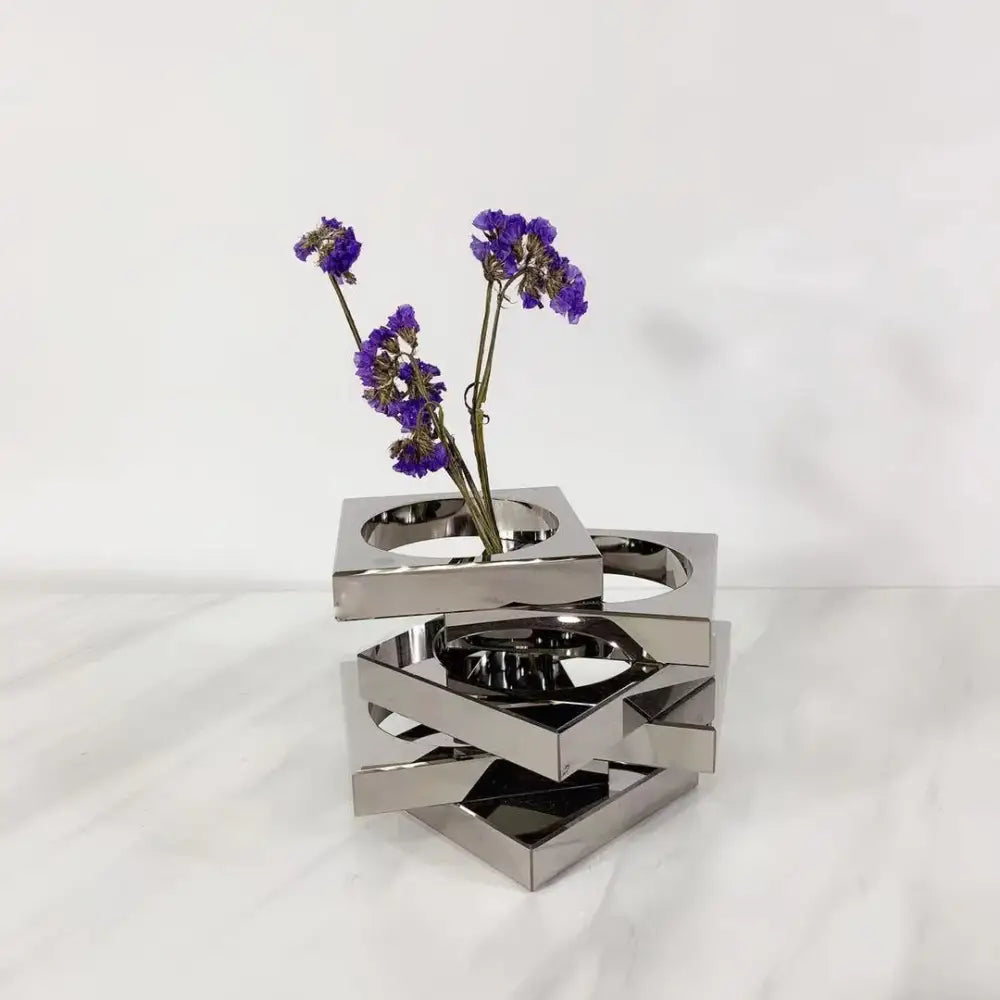 Modern silver geometric circle crystal glass vase with stacked square cutouts holding dried purple flowers decorbites crystal glass geometric decor