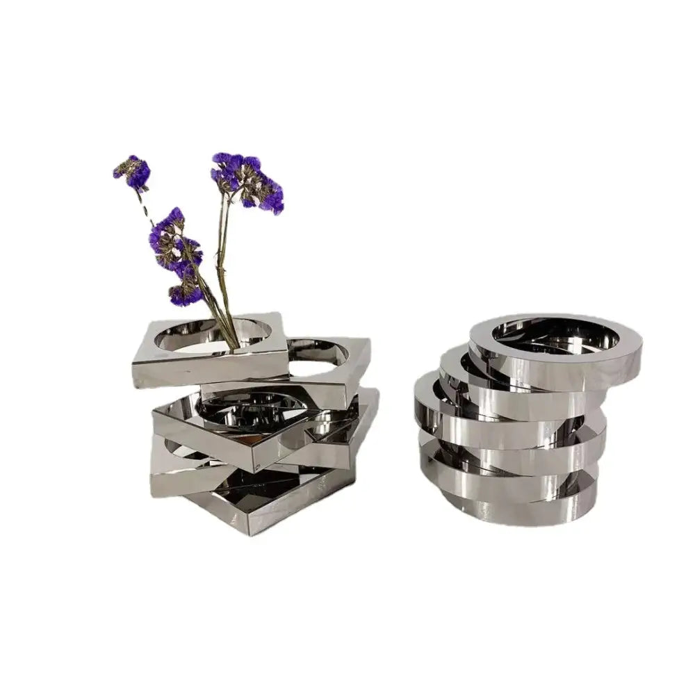Stacked silver metallic geometric circle vases with dried purple flowers and circular rings decorbites crystal glass decor