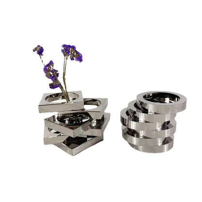 Stacked silver metallic geometric circle vases with dried purple flowers and circular rings decorbites crystal glass decor