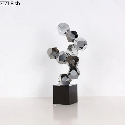 Modern silver geometric crystal ball desk ornament featuring interlocking faceted glass orbs on black base