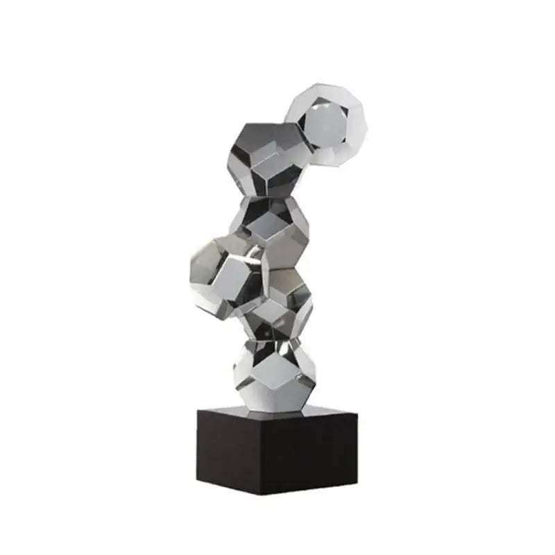 Modern silver geometric desk ornament with faceted interlocking hexagonal forms on black base crystal ball desk