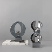 Modern silver geometric crystal sculpture with interlocking circular elements for home decor by decorbites geometric crystal