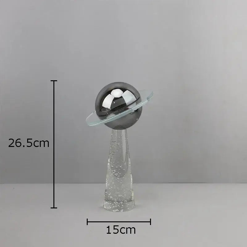 Modern silver geometric crystal star desk sculpture with a reflective metallic sphere and glass bubble base decorbites geometric crystal