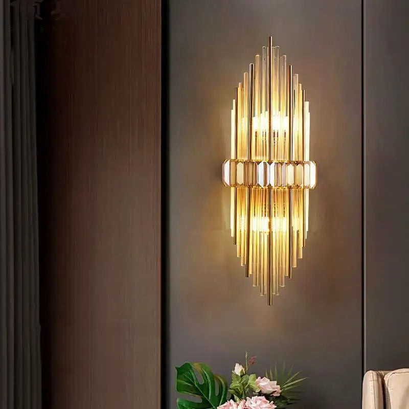 Modern gold-toned wall lamp with vertical glass tubes and decorbites crystal strip led accents for bedroom sconce decor