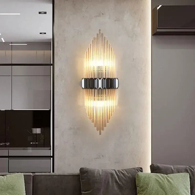 Modern gold-toned wall lamp with vertical glass rods and black geometric accent featuring decorbites crystal strip led design