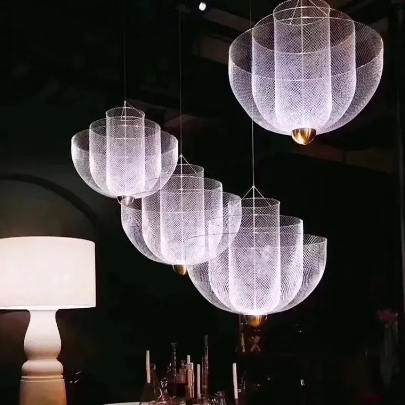 Elegant white mesh pendant lights with gold-toned bases in a modern decorbites geometric iron chandelier design