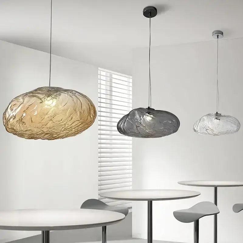 Modern silver glass led chandelier featuring three cloud-shaped translucent amber gray and clear glass led shades for dining room