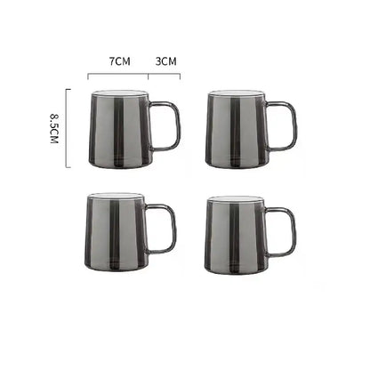 Set of four sleek dark gray translucent glass mugs paired with a modern silver glass water pitcher with lid