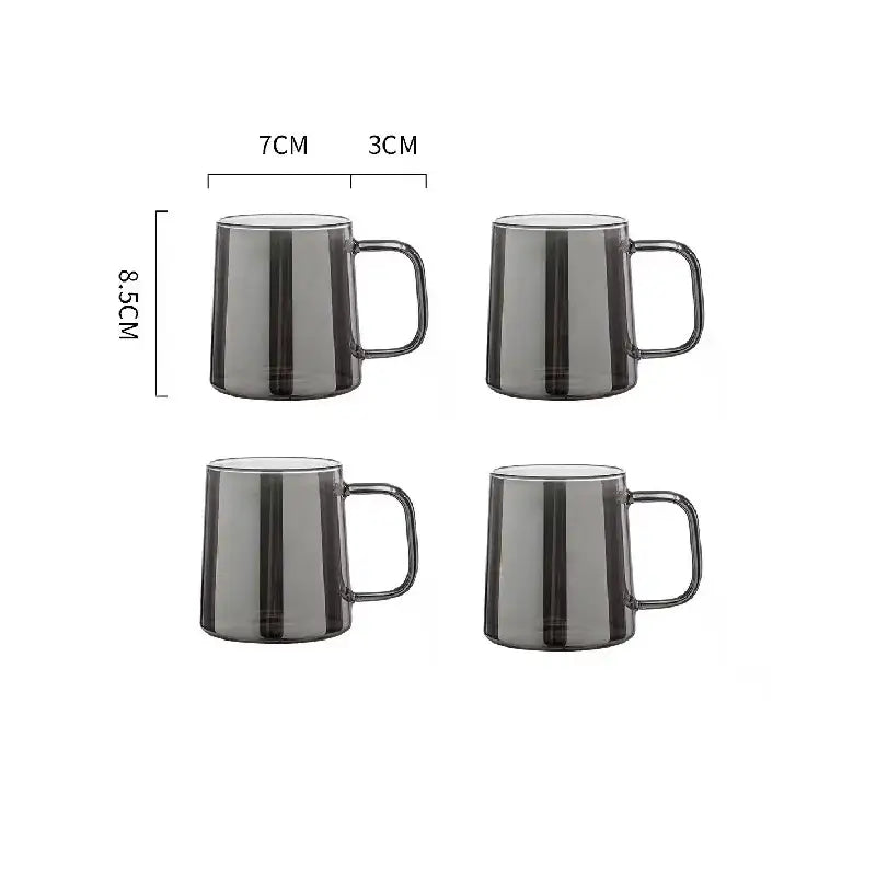 Set of four sleek dark gray translucent glass mugs paired with a modern silver glass water pitcher with lid