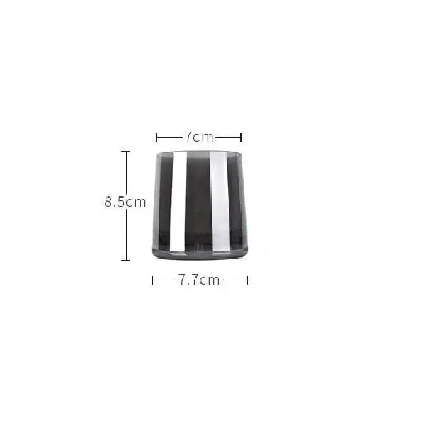 A sleek cylindrical glass water pitcher with bold vertical black and silver stripes and a lid for kitchen use