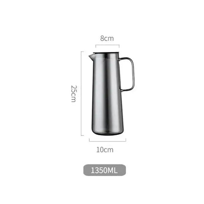A sleek stainless steel silver water pitcher with a modern design and sturdy handle for kitchen juice or glass water use