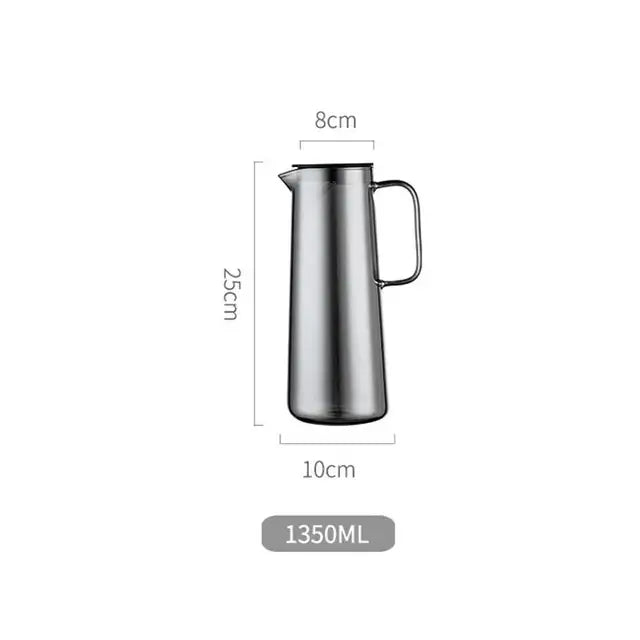 A sleek stainless steel silver water pitcher with a modern design and sturdy handle for kitchen juice or glass water use
