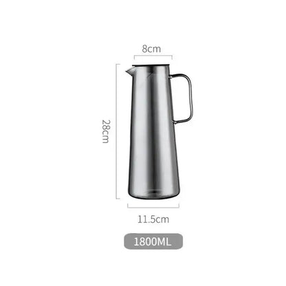 A sleek stainless steel modern silver water pitcher with lid and sturdy handle for kitchen juice and glass water use