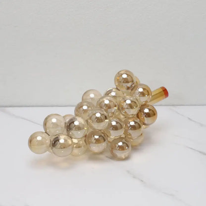 Modern silver gold and chrome crystal grape decorative sculpture features a translucent gold glass decorbites crystal grape ornament