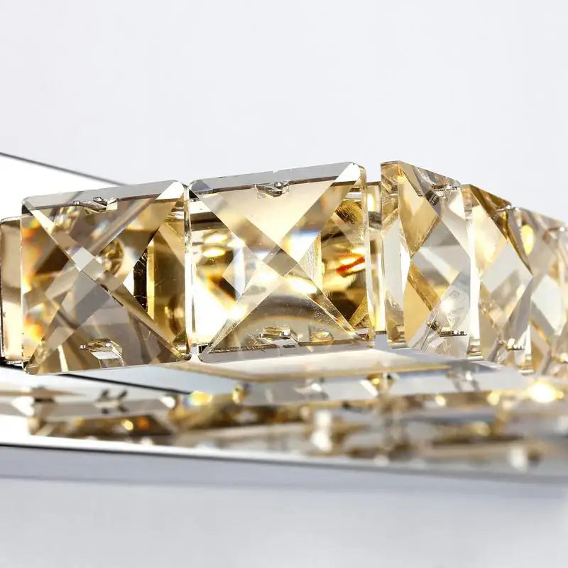 Gold-toned crystal wall lamp with faceted square crystals and metallic frame for decorbites crystal bedroom mirror decor