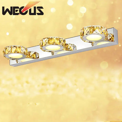 Modern silver and gold decorbites crystal bedroom wall lamps with three illuminated circular LED bulbs for bedroom mirror use