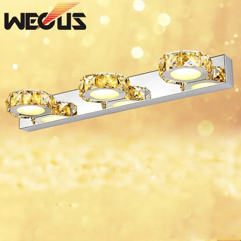 Modern silver and gold decorbites crystal bedroom wall lamps with three illuminated circular LED bulbs for bedroom mirror use