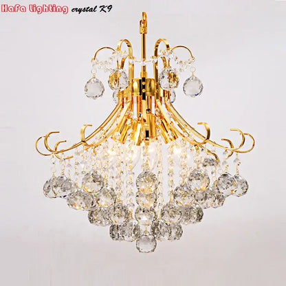 Modern silver and gold decorbites crystal chandelier with cascading clear faceted beads and teardrop crystals for living rooms