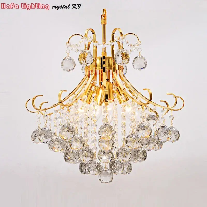 Modern silver and gold decorbites crystal chandelier with cascading clear faceted beads and teardrop crystals for living rooms