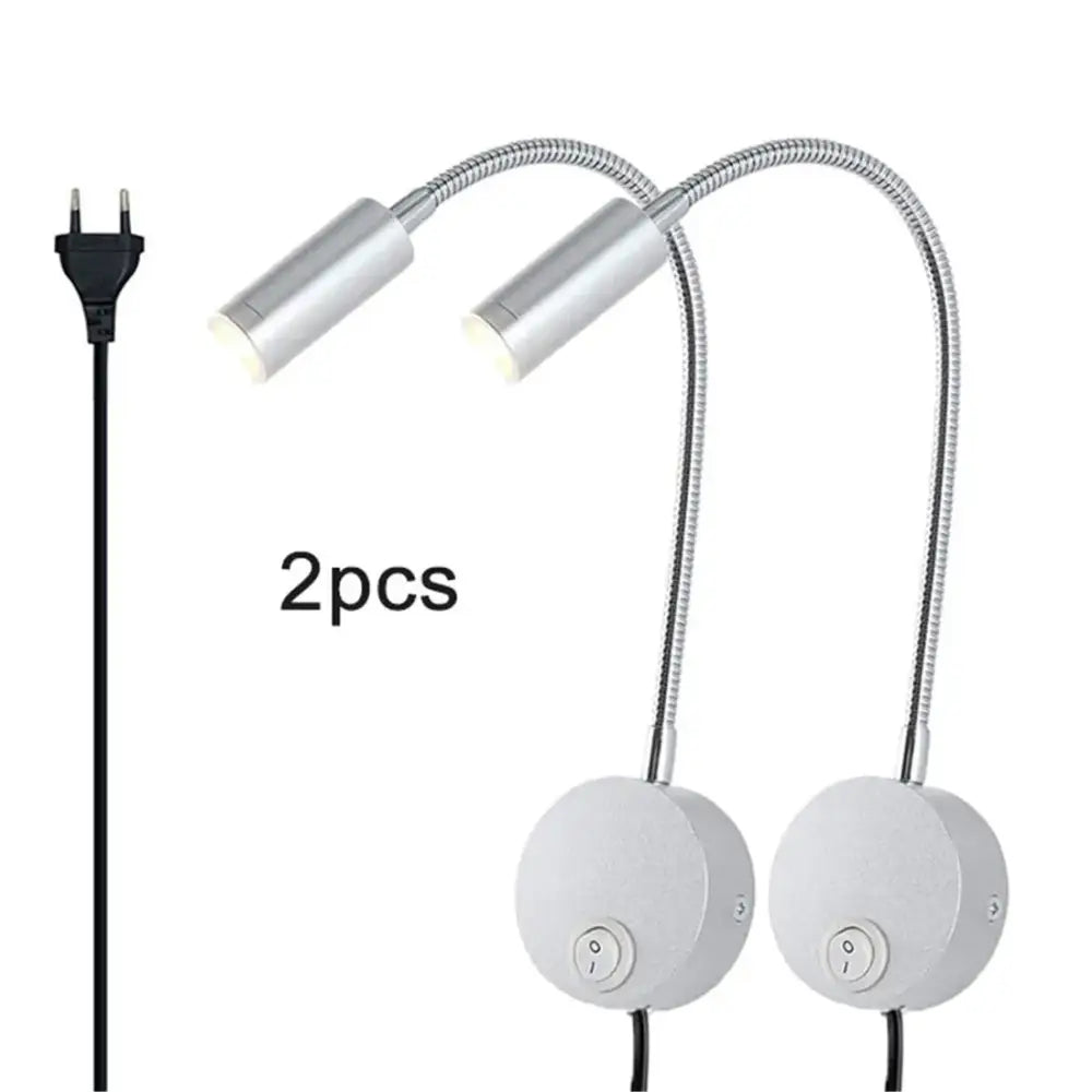 Two sleek silver gooseneck led wall lights with flexible metal arms and white circular bases for wall light reading