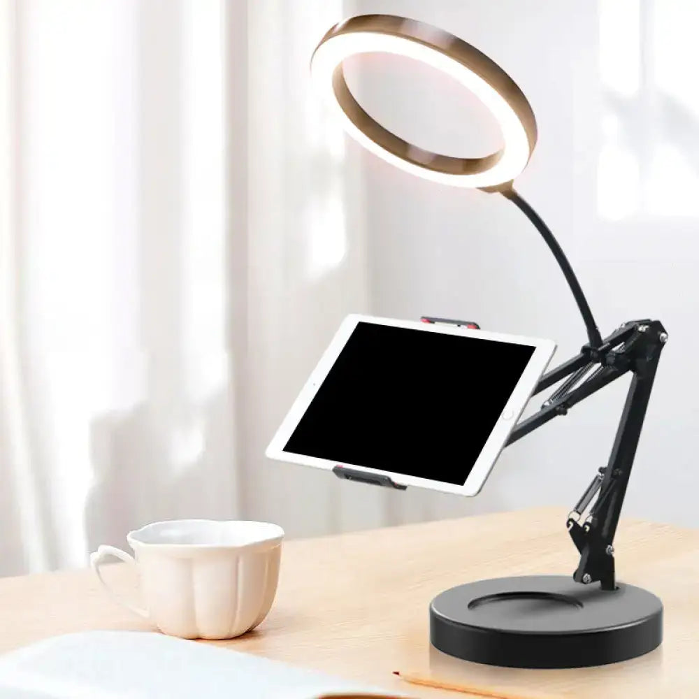 Black adjustable ring light desk lamp with gold led halo and mobile phone holder for bedroom desk use