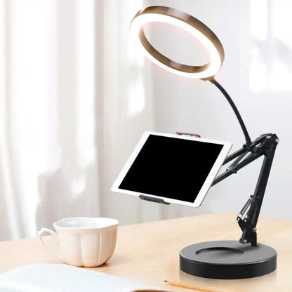 Black adjustable ring light desk lamp with gold led halo and mobile phone holder for bedroom desk use