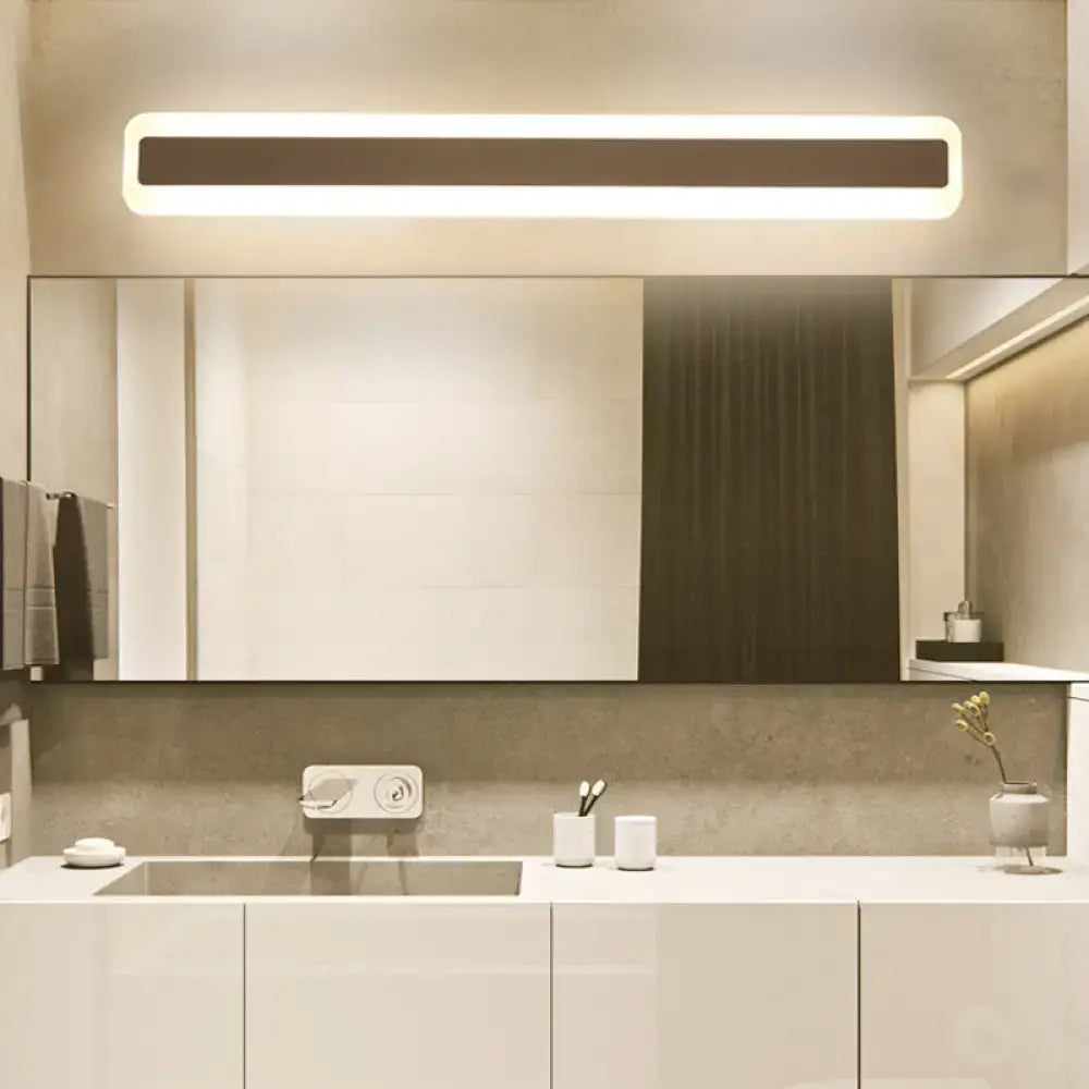 Modern silver led wall light with elongated metal shade and sleek white frame featuring warm ambient glow