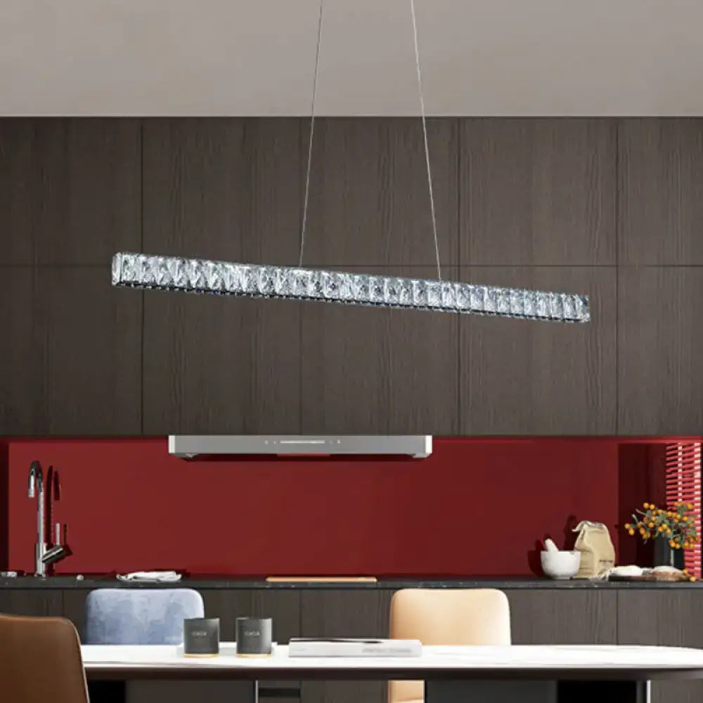 A decorbites™ linear crystal block island pendant with sleek silver frame and clear crystals for dining room lighting