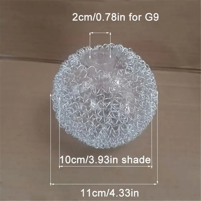 Transparent spherical stress ball with interwoven metallic wire texture resembling decorbites glass lampshade design