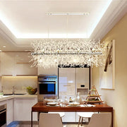 DecorBites modern silver metal linear island light with 12 lights and sleek branching crystal arms for dining room