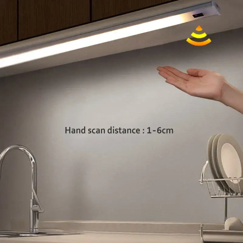Modern silver rectangular led cabinet light with a sleek white strip and hand sweep switch for hands-free operation