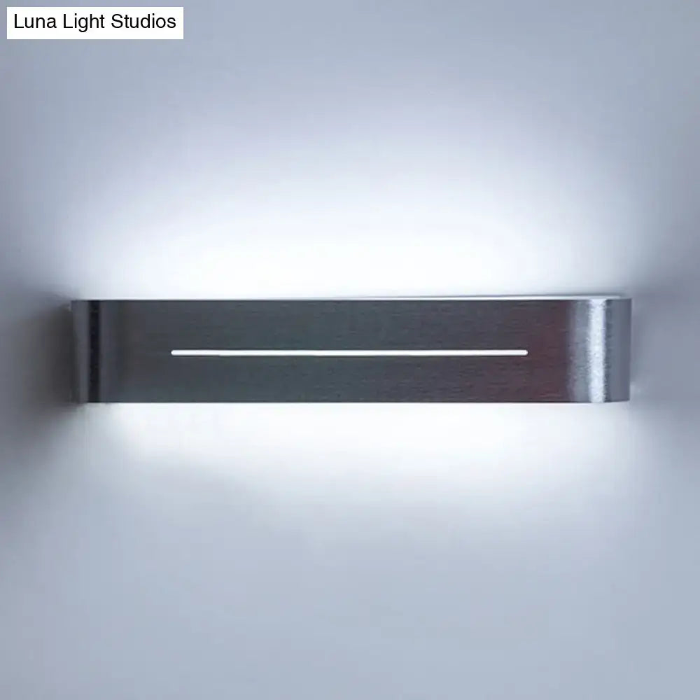 Modern silver rectangular led wall sconce with aluminum shade and brushed stainless steel finish featuring central linear led light strip