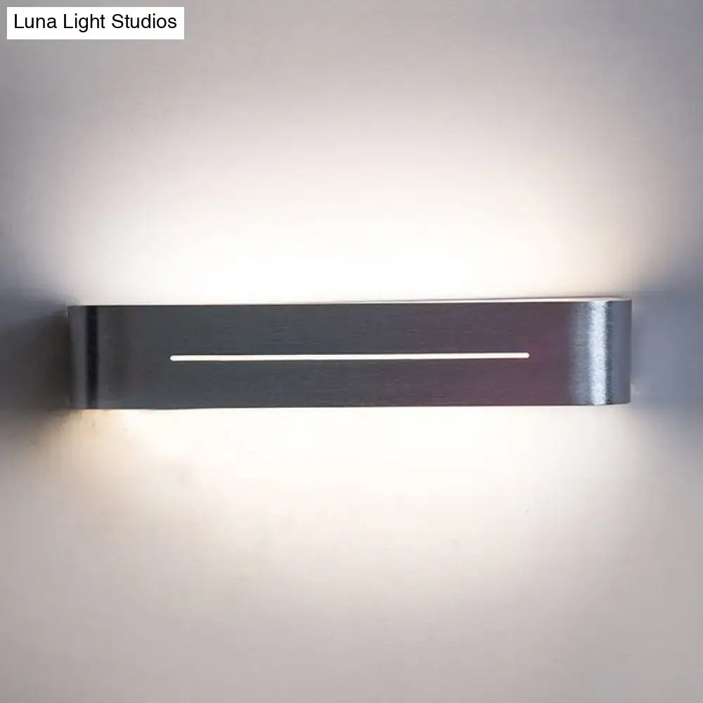 Modern silver rectangular led wall sconce with sleek brushed metal finish and aluminum shade for bedroom lighting