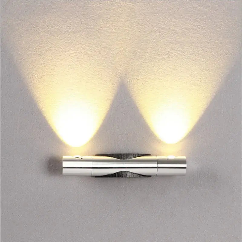 Modern silver rotatable wall lamp with dual adjustable spotlights and brushed metallic finish by decorbites wall lamp