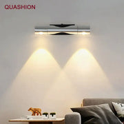Modern silver rotatable wall lamp with dual adjustable metallic spotlights casting warm focused beams by decorbites wall lamp