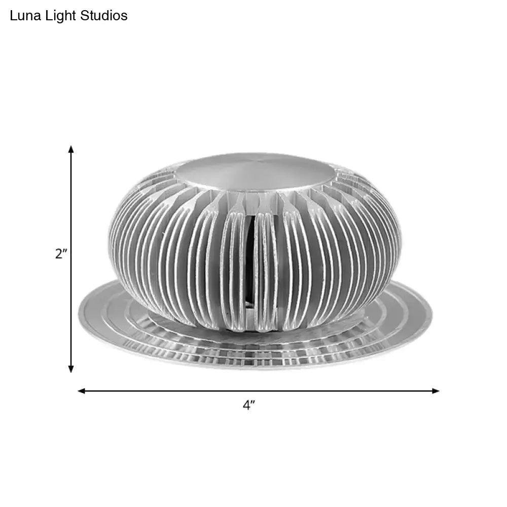 Modern silver starburst led sconce with ribbed aluminum housing and base, 2-inch tall direct wired electric ceiling light