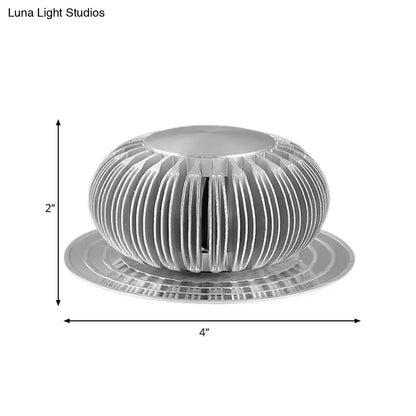 Modern silver starburst led sconce with ribbed aluminum housing and base, 2-inch tall direct wired electric ceiling light