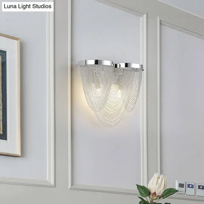 Modern silver tassel chain wall light with chrome finish and clear crystal beads for sitting room sconce lighting
