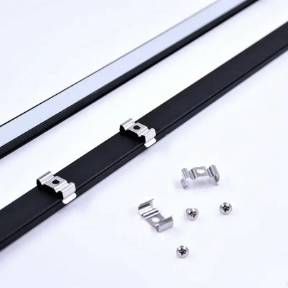 Black led bar strip with silver metal clips and screws for secure installation under kitchen cabinets