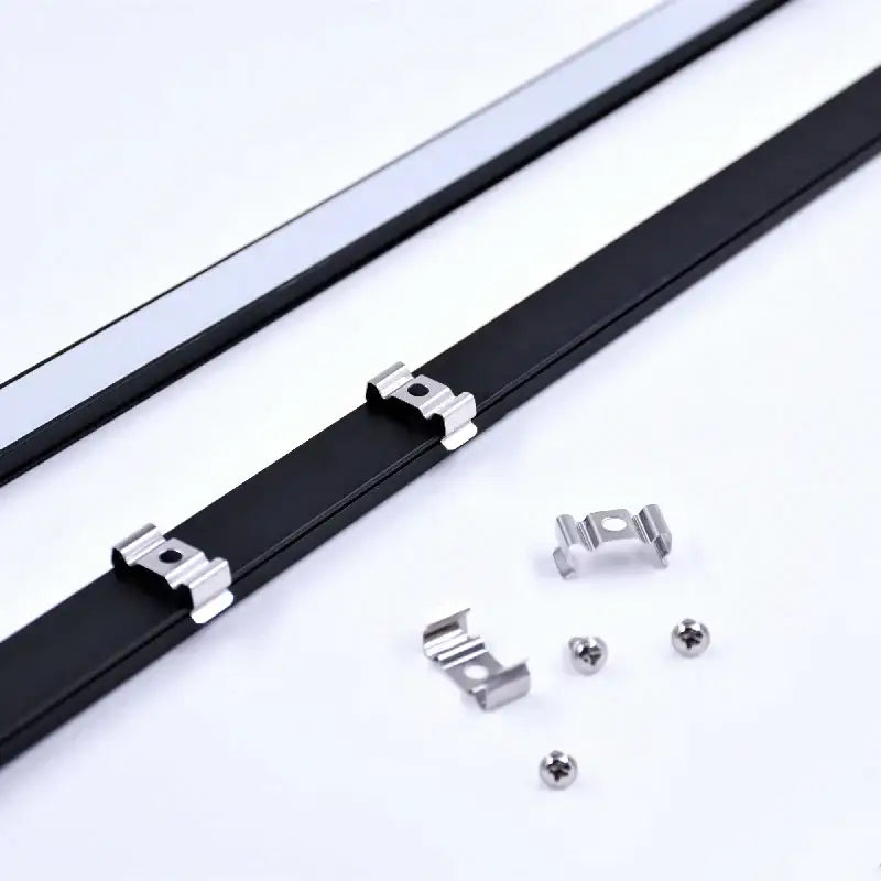 Black led bar strip with silver metal clips and screws for secure installation under kitchen cabinets