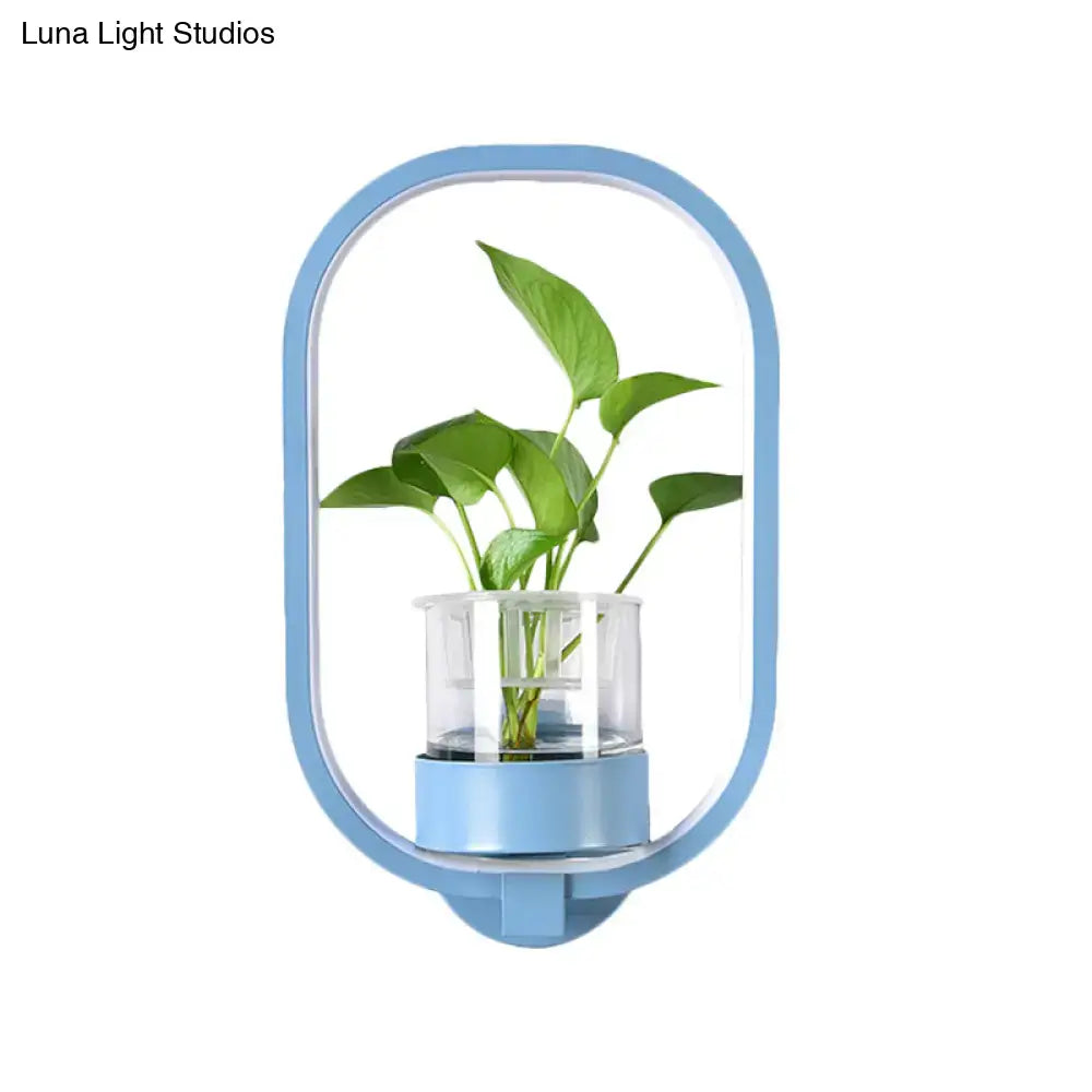 Modern silver wall light with light blue oval plant pot and clear acrylic reservoir for bedroom 110v-120v sconce