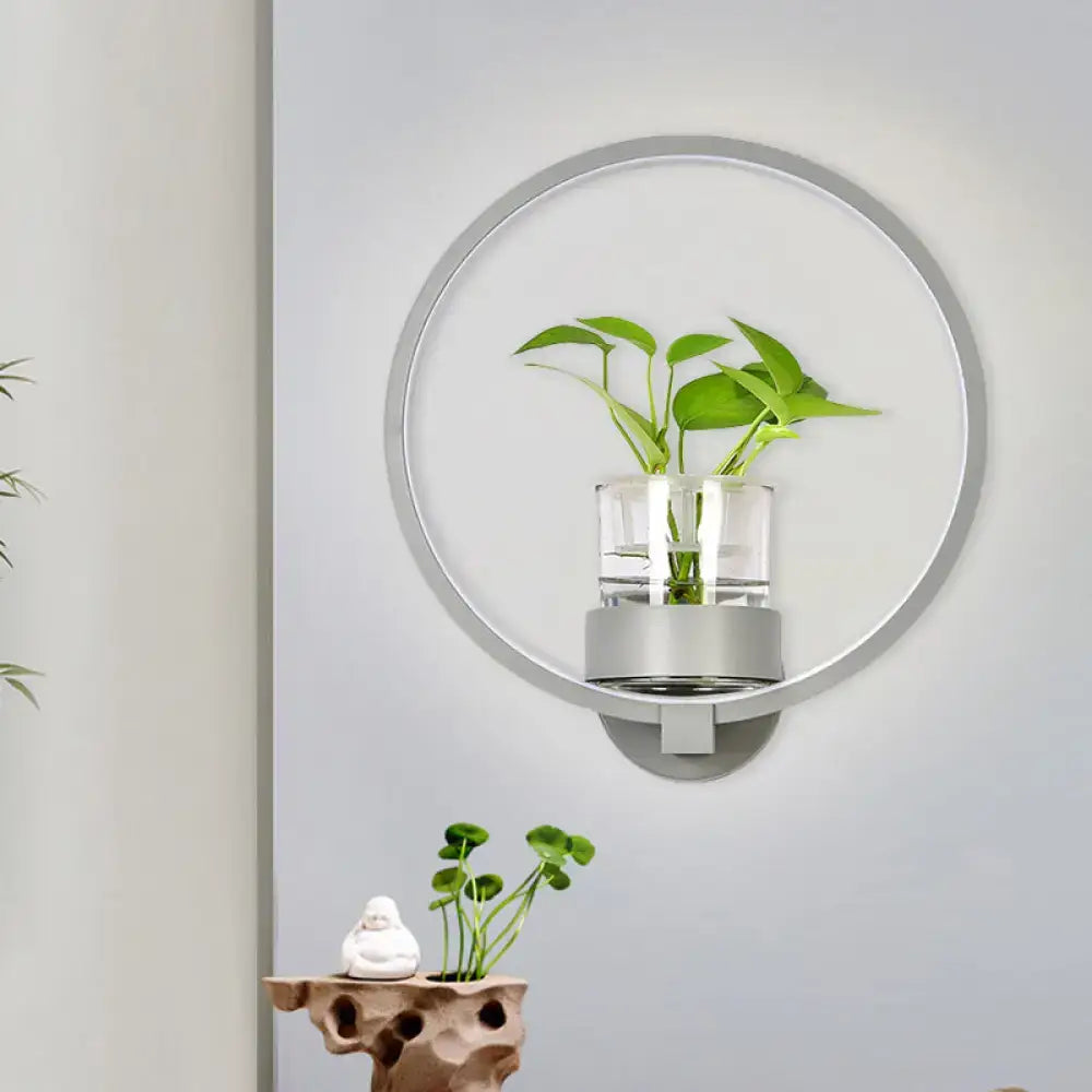 Modern silver circular wall light with plant pot featuring a clear glass cylinder and 110v-120v led sconce for bedroom